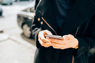 Young woman wearing black coat