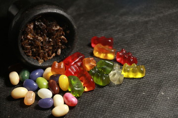 bowl with tobacco for hookah. fruits on a black background. smoke hookah