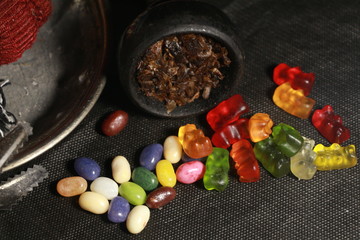 bowl with tobacco for hookah. fruits and berries on a black background. smoke hookah