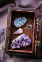 Witch tools inside beautiful old wood box. Rose quartz pendulum, natural amethyst and celestite...