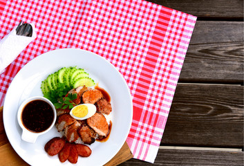 Barbecued red pork in sauce with rice..Thai Pork Menu.