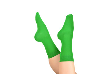 Woman in green socks isolated on white background. Top view.