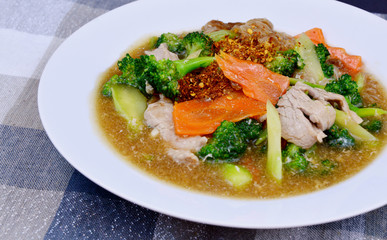 pork and Broccoli and carrot in thick gravy with thin rice noodles