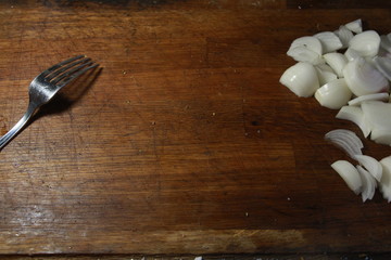 fork and knife on wooden table