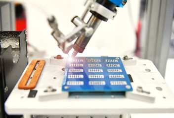 High technology and modern automatic robot for print circuit board (PCB)assembly machine during...