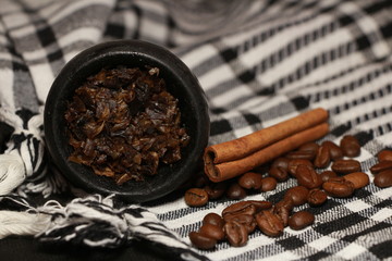 bowl with tobacco for hookah. berries on a black background