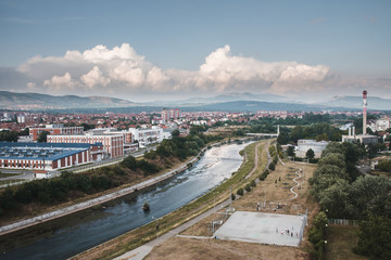 Obraz premium niš, city, landscape, river, street, travel, mountains, srbija, cityscape, architecture, panorama, mountain, building, aerial, landmark, tourism, town, water, urban, serbia, sky, clouds, park, outdoor