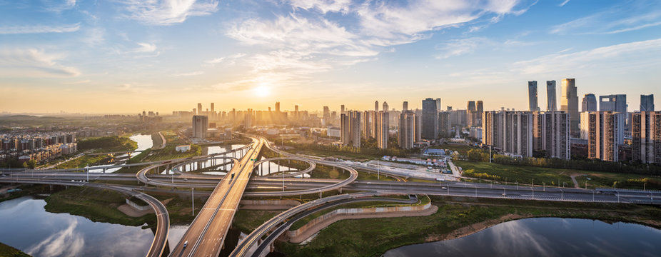 Sunrise Of Urban Overpass，skyline And Traffic,flyover In Modern City. 