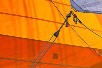 Yellow and orange sails closeup.
