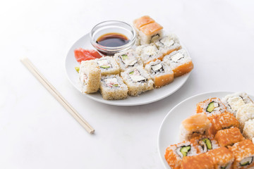 Assortments of sushi with sauce and chopsticks