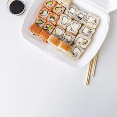 Top view of a poke bowl with sushi