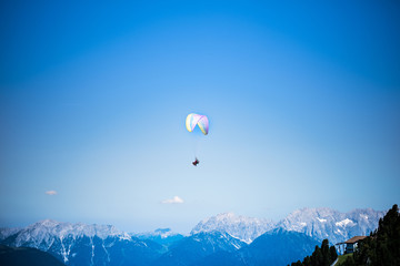 Paragliding in mountains. Para gliders in fight in the mountains, extreme sport activity.