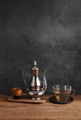 Group of arabic tea in glass and metal tea pot,Tea set with a blank space for a text