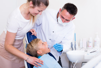 Fototapeta premium Mother with child are visiting dentist