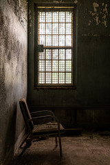 Fototapeta na wymiar Derelict Patient Room with Lone Chair - Abandoned Creedmoor State Hospital - Queens, New York City, New York