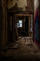 Derelict Hallway with Chair - Abandoned Creedmoor State Hospital - Queens, New York City, New York