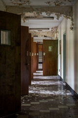 Derelict Hallway with Open Doors - Abandoned Rockland State Hospital - New York