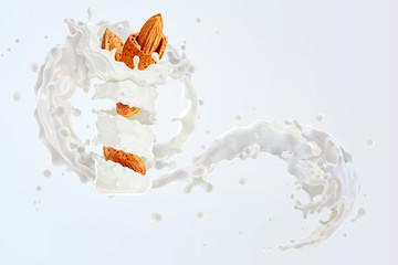 Fresh natural almond milk 3D splash swirl with almonds isolated. Healthy splashing almonds milk, milk shake, almond seeds, yogurt, cream waves. Organic vegan liquid splash nuts dairy design commercial