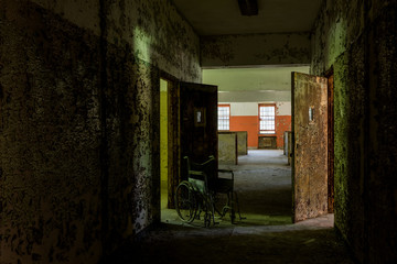 Derelict Hallway + Wheelchair - Abandoned Creedmoor State Hospital - Queens, New York City, New York