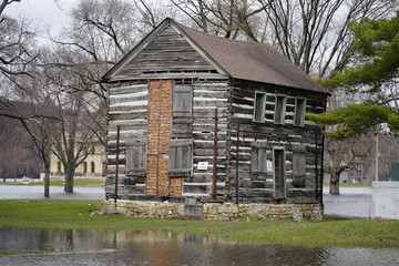 Old a banded house sits alone on a small island