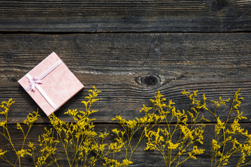 Yellow flowers on wooden background