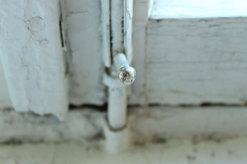 Locked catch of an old window.