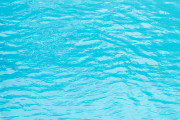 Waving blue water surface. blue clear fresh Water in jacuzzi.