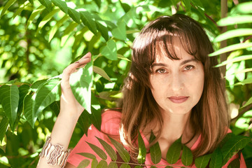 portrait of a woman in tree branches