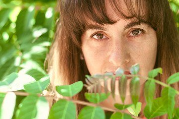 portrait of a woman in tree branches