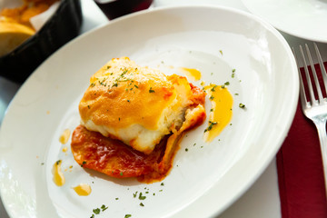 Closeup of  codfish backed with sauces and served, nobody