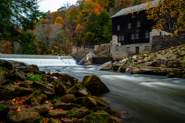 Rustic Mill Adjacent to Rushing Stream in Peak Autumn / Fall Season - McConnells Mill State Park -...