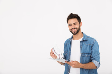 Image of handsome pleased man holding clipboard with infographics and smiling
