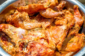Marinated chicken meat close-up cooked for grilling