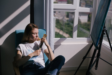 Woman artist with a painting