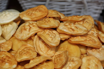Stack of smoked traditional Polish sheep cheese, in small pieces, made in Tatra mountains area, close up