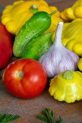Vegetables on a wooden background close-up. Autumn rich harvest. Rural still life.