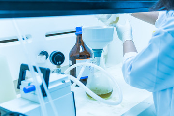 Asian scientist working in the lab,Experiment for customer,Using the formula, the physics and chemistry to calculate the value of the experiment,Thailand people