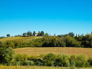 Fototapeta na wymiar Hills, fields and meadows - typical views of Tuscany.