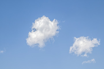 White cloud on a blue sky as a background, screensavers on a computer, creativity for design.