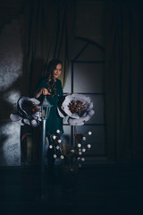 beautiful girl among the flowers and lantern in the shade. Spring mood-a woman in a fairy-tale world