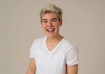 Portrait of attractive cheerful transgender young man with smiling happy face. Human expressions...