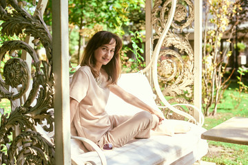 portrait of a woman on a park bench