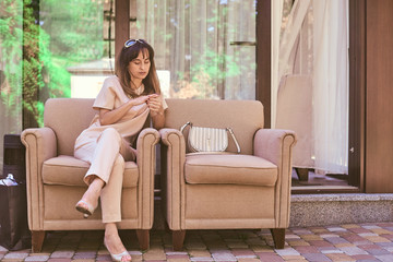 woman on a sofa near a restaurant