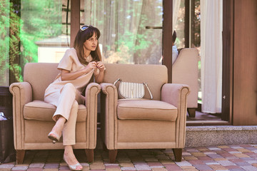 woman on a sofa near a restaurant