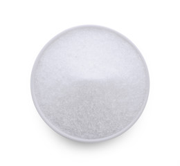 monosodium glutamate in wood bowl on white background