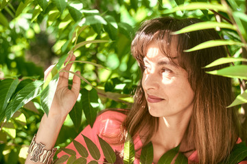 portrait of a woman in tree branches