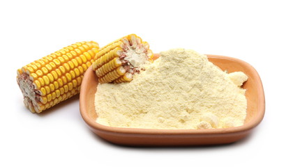 Fototapeta na wymiar Pile corn flour in clay pot and dry grain ears isolated on white background