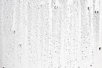 white isolated background water drops on the glass / wet window glass with splashes and drops of water and lime, texture autumn background - obrazy, fototapety, plakaty