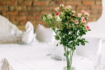 Wedding image and a bridal bouquet with red flowers	