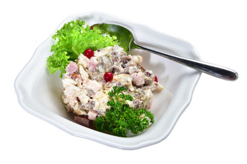Meat and vegetable salad with sauce on an isolated white background